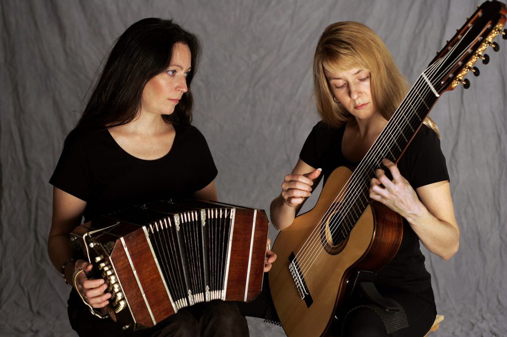 Two women playing instruments, bandoneon and decacorde